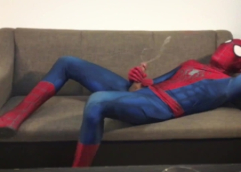 Horny Spiderman jerks off and cums massive load